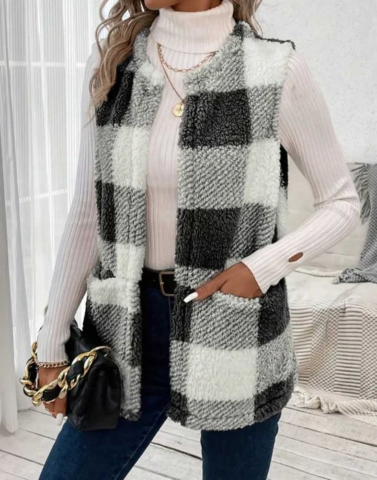 Елегантен дамски пухен елек