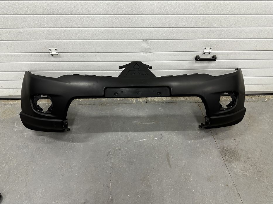 Бампер передний Паджеро Спорт