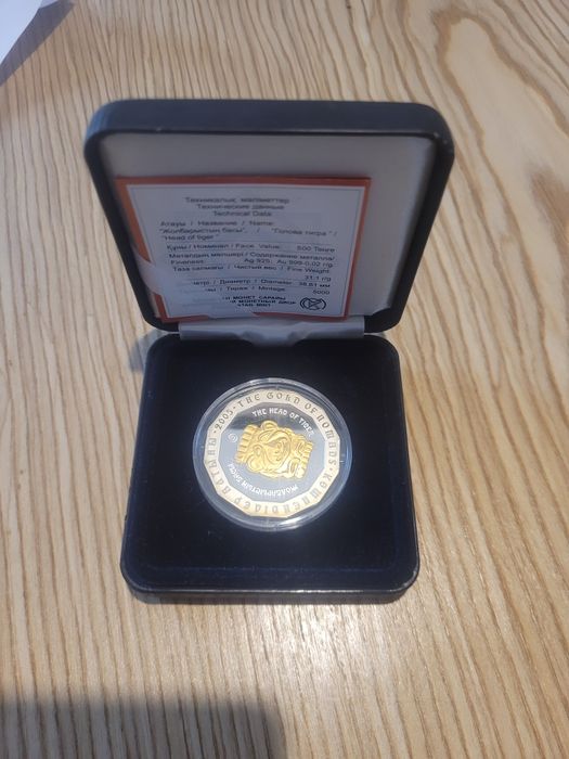 Монета голова тигра
