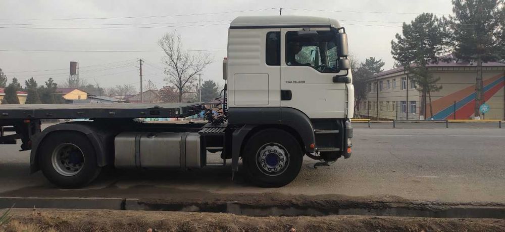 Uz MAN 19.400 ва прицеп UzAuto Trailer бортли контейнеровоз 2в1