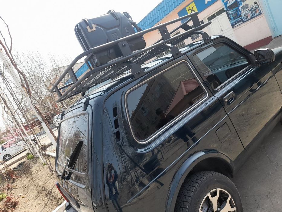 Багажник мошинани томига нивага