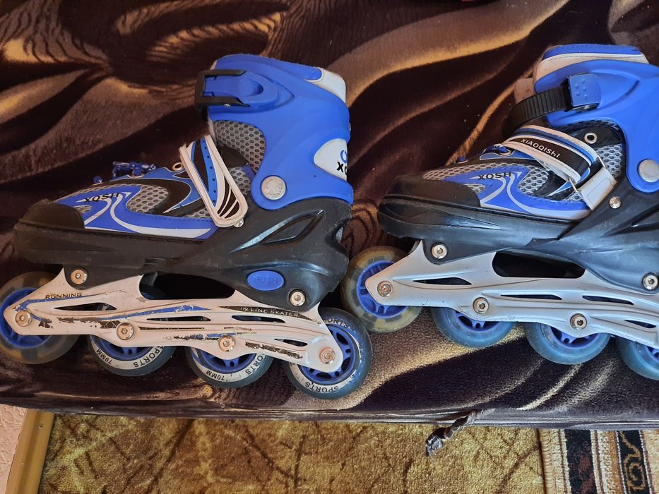 Роликовые коньки