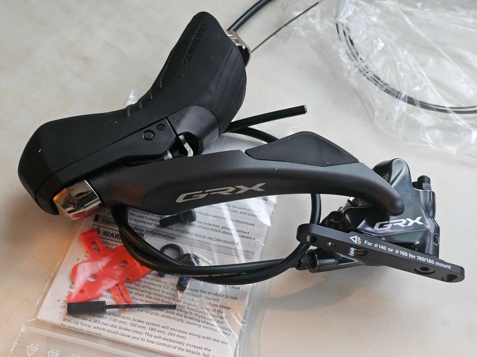 Set frane manete Shimano GRX ST-RX810 + BR-RX810 2x11 fata + spate noi