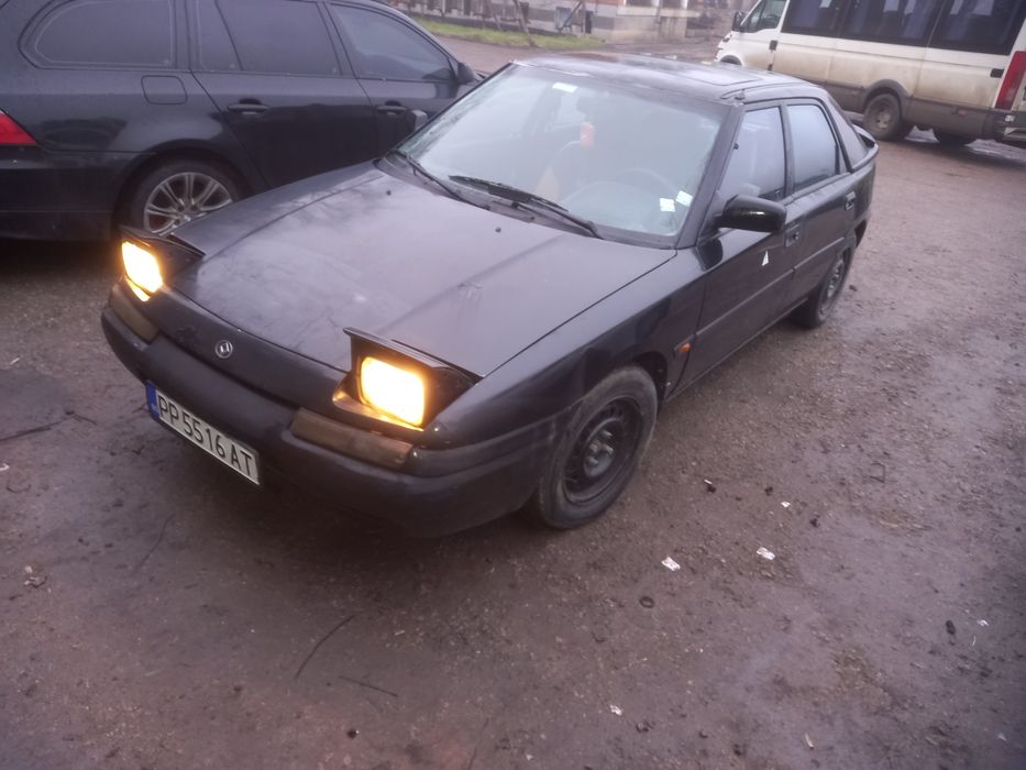 Мазда323 1.6 16 клапан,бензин.газ инжец
