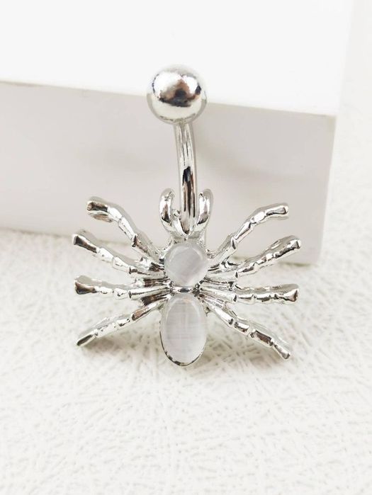 Пирсинг в пупок.