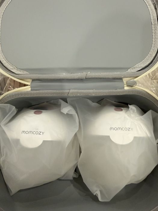 Продам автоматический молокоотсос Momcozy