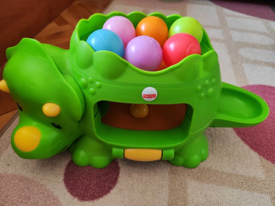 Играчка динозавър с топчета Fisher Price