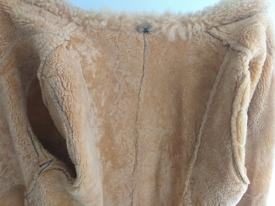 Дублёнка тёплая, тигрового цвета.