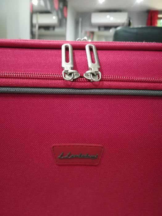 Куфар с колелца и телескопична дръжка