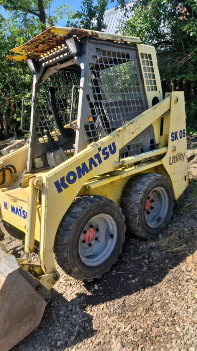 Vând bobcat komatsu sk 05