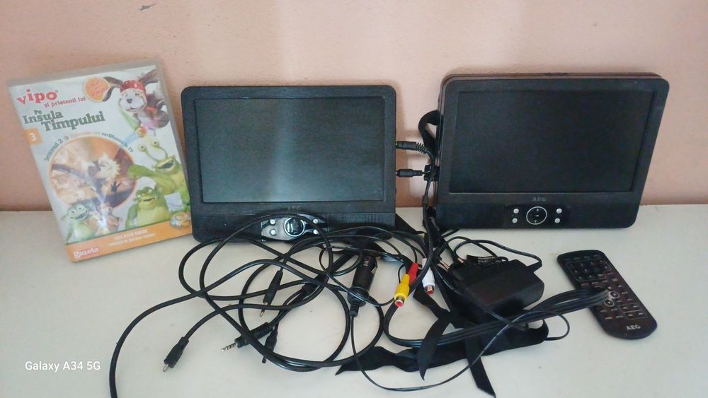 Vând DVD AEG  cu 2 monitoare pt tetiere