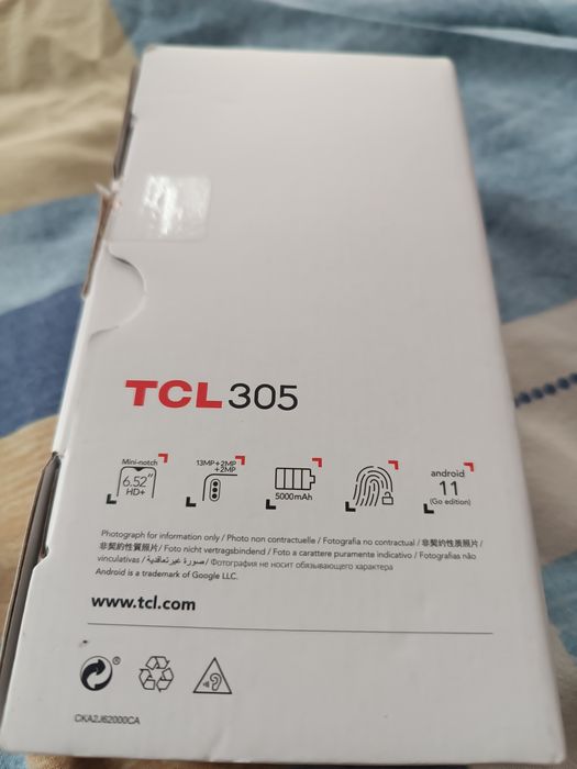 TCL 305 телефона е нов +слушалки нови