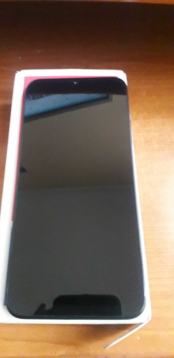 Smartphone Redmi A7 Pro si Nokia Asha 214