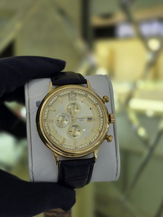 Продам золотые часы Tissot 750 пробы