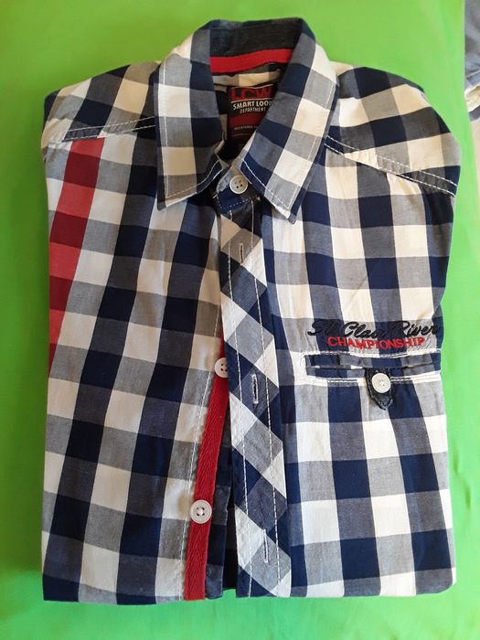 Риза 134-140 см.