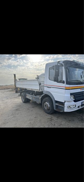 Închirieri buldoexcavatoare, basculante 8x4 , trailer