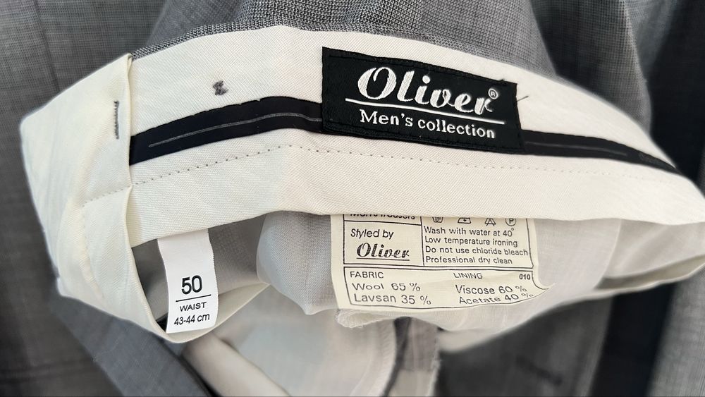 Продам костюм серого цвета