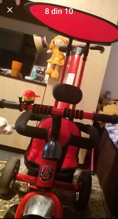 Vând bicicleta cu pedale,  copertină și mâner de ghidare