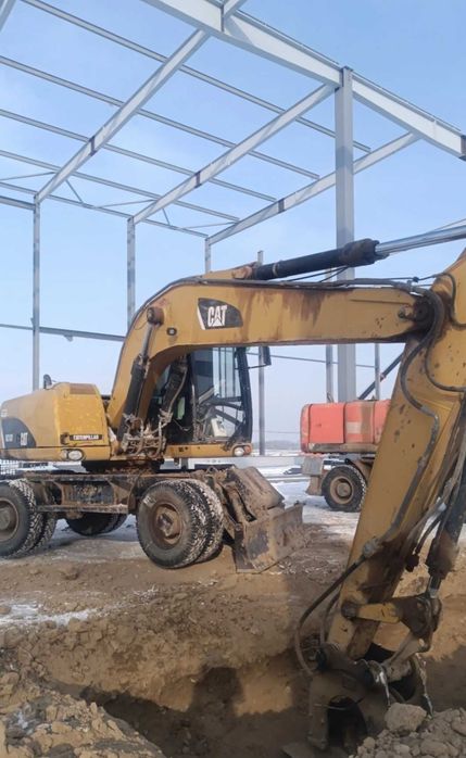 Продам колёсный экскаватор Caterpillar M318D