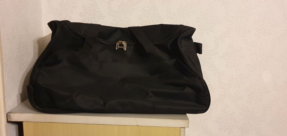 Чанта за пътуване на колела и с дръжка