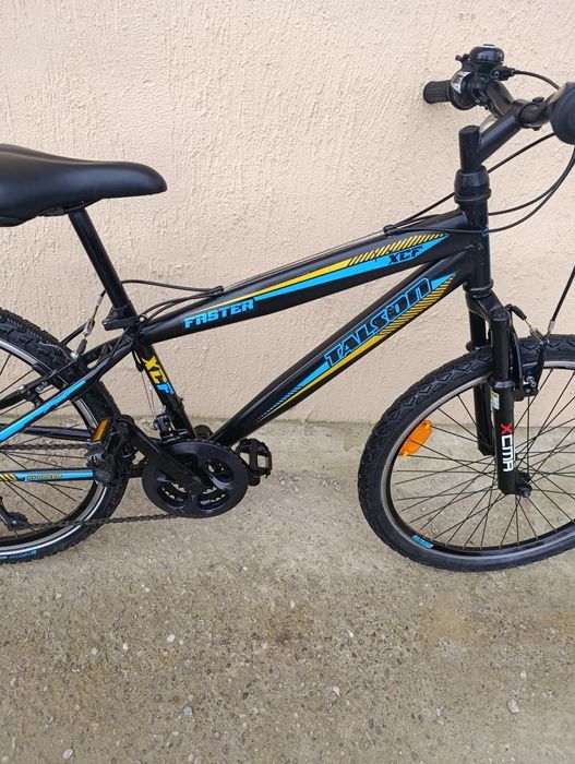Vând bicicletă copii cu roți pe 24.