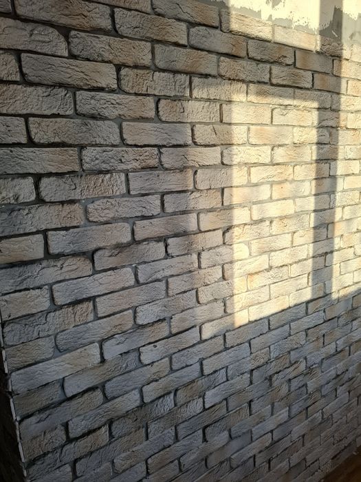 Балконы,кладка кирпича под расшивку.Утепление стен