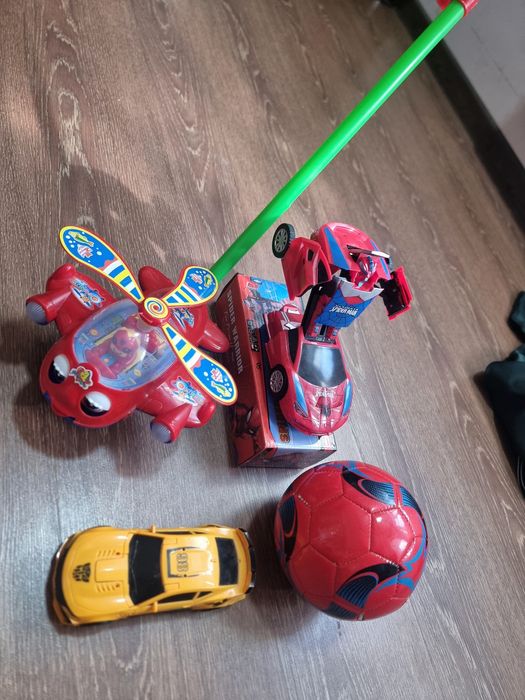 Цена за все Игрушки 2 шт трансформер светомузикалний работает Каталка