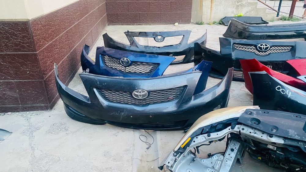 Передний бампер Королла 150