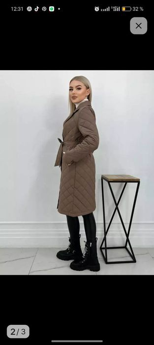 Стеганное польто. Размер 50  новый. Производство Россия.