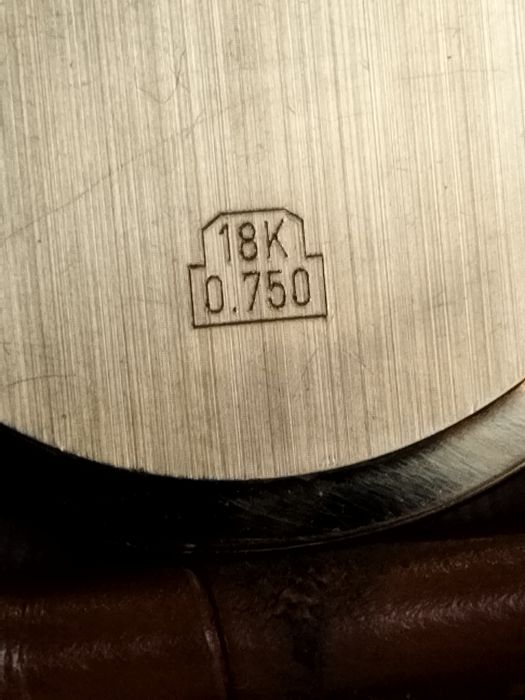 Женева золотые часы 750 пробы.