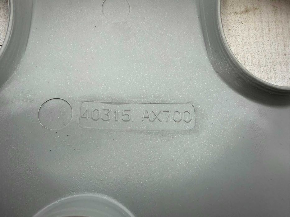 Capac Roată R15 Gri Argintiu Nissan Micra 40315AX700 2004 / [2003-2007] / (4B2)