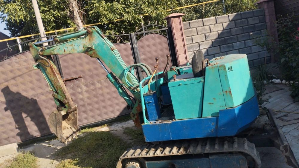 Японский миниэкскаватор Takeuchi TB