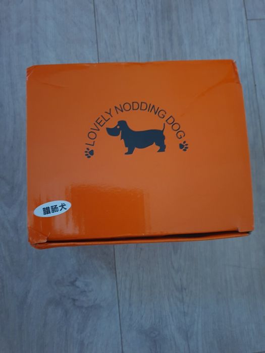 Автомобильная кукла собачка такса.