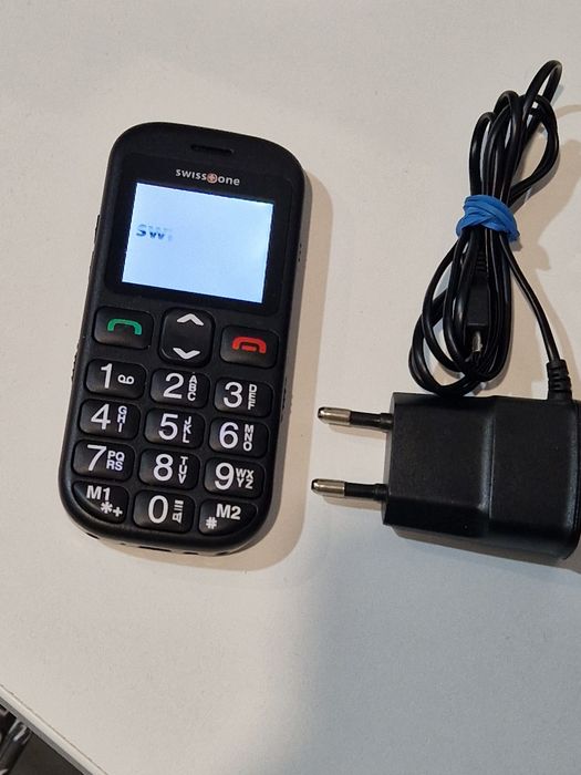 Telefon cu butoane cu încărcător