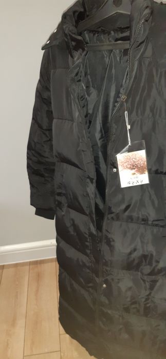 Продам пуховик новый