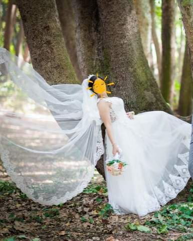 Булчинска  рокля и дълъг воал