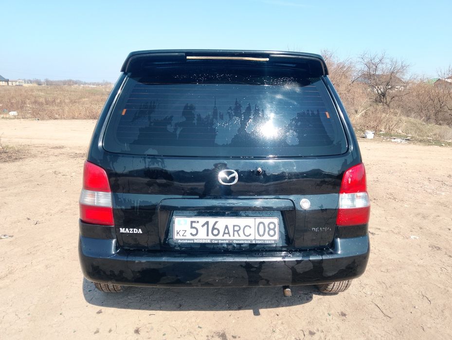 Мазда демио 2003 года