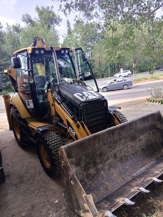 Экскаватор погрузчик Талгар