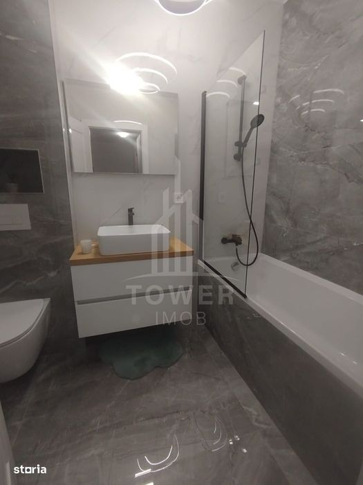 Apartament modern de închiriat, cu balcon și loc de parcare