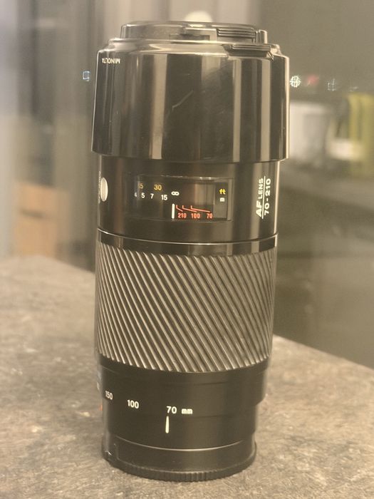 Sony SLT-A58 + Sony 50mm f/1.4 + Minolta 70-210mm + 18-55mm