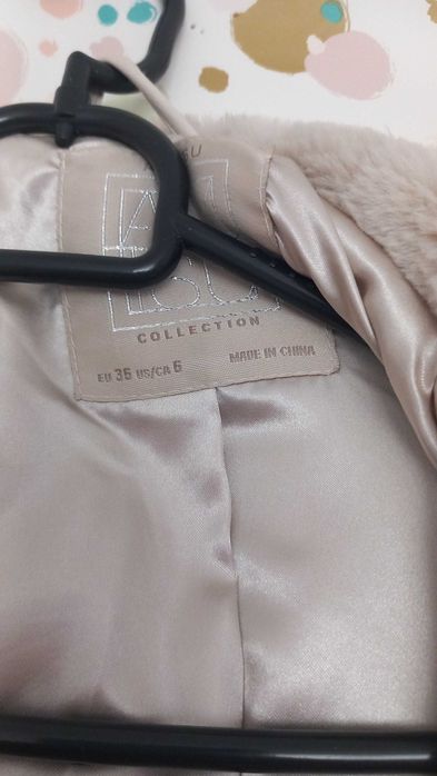 Haina blana artificială Amisu