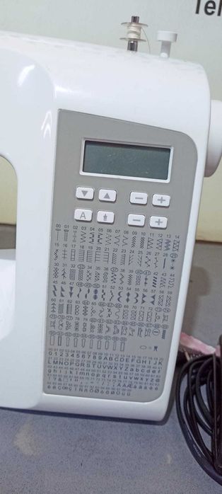 Masina de cusut Singer    Serenade cu peste 100 modele cusaturi