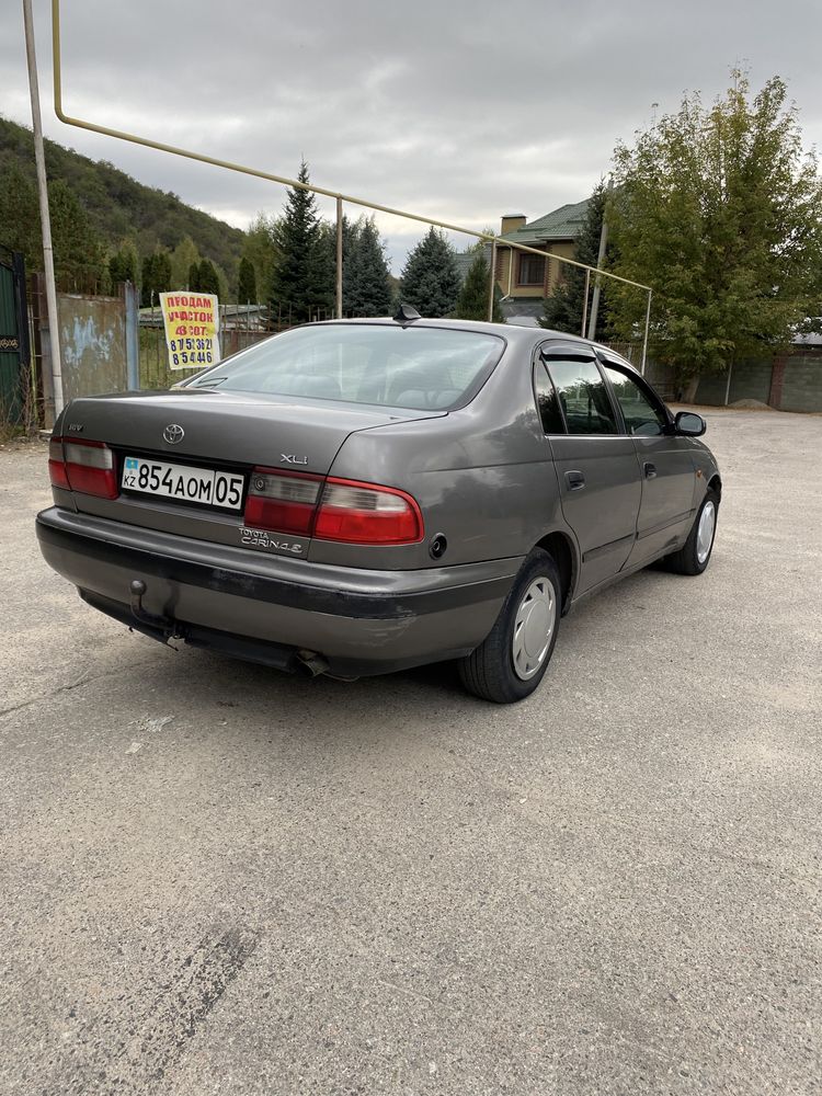 Фото Toyota Carina E (Тойота Карина Е)