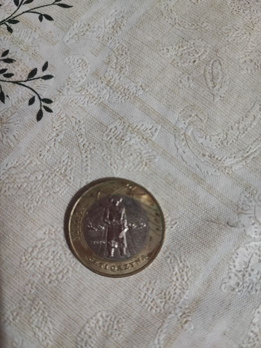 Монета юбилейная 100 тн