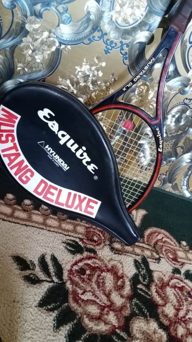 Теннисный ракетка