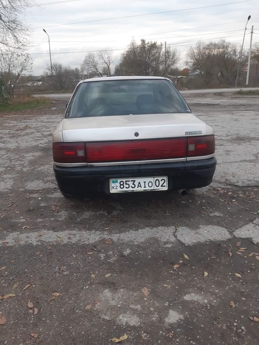 Машина мазда 323