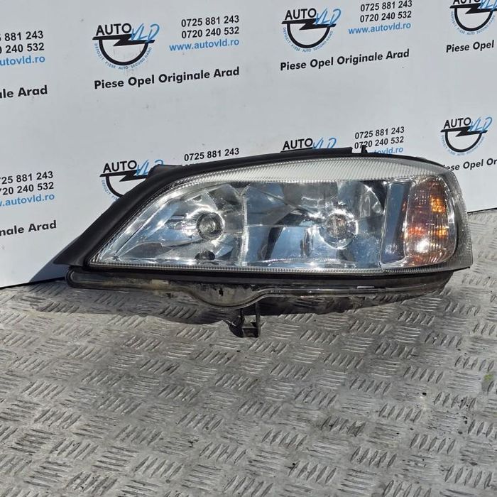 Far stanga fundal crom Opel Astra G