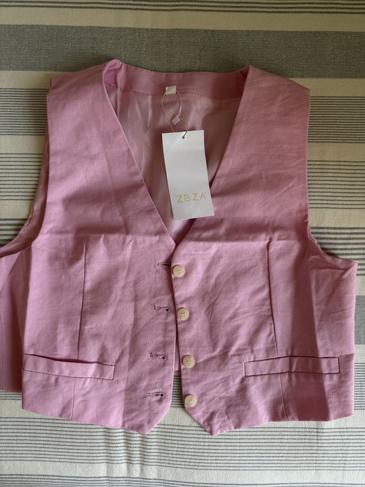 Розовая жилетка