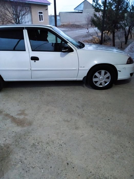 Нексия 2 . Г.2012. белый. Метан. Люкс кондиционер. Бухоро Вобкент