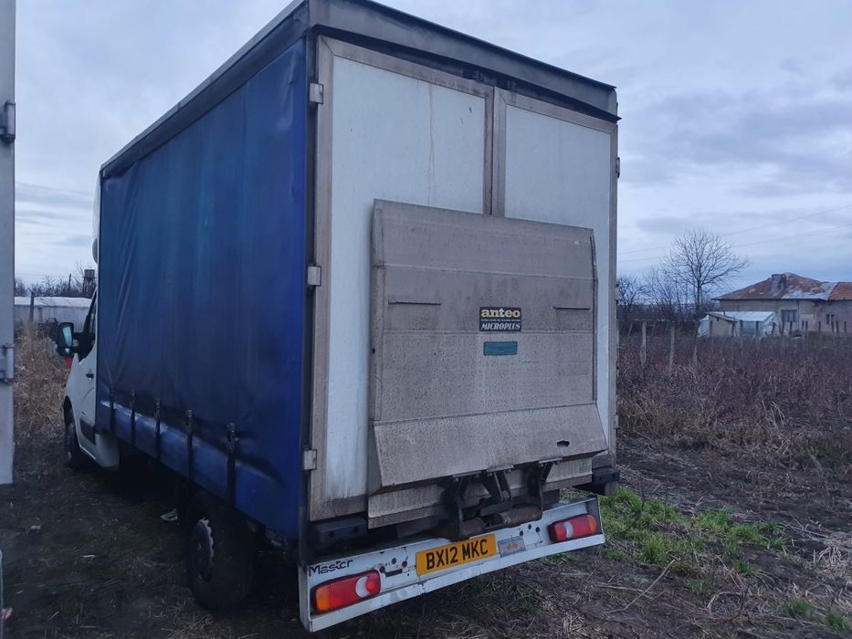 Bena cu usi pe spate și prelată pe role lift hidraulic master Iveco Me